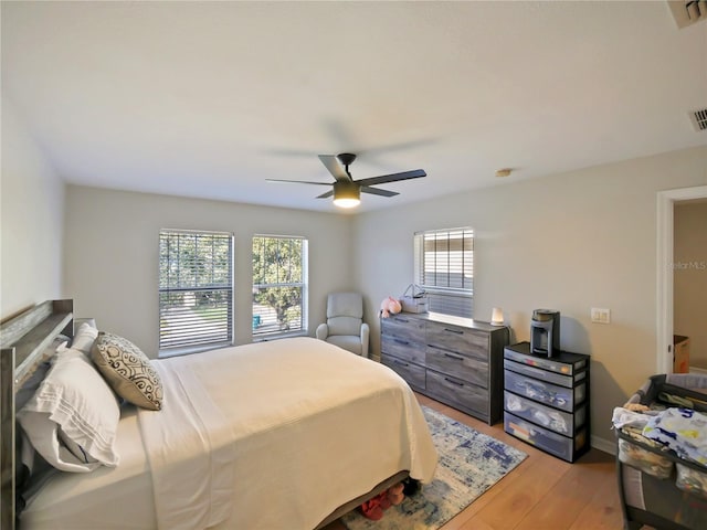 bedroom featuring ceiling fan and light hardwood / wood-style floors