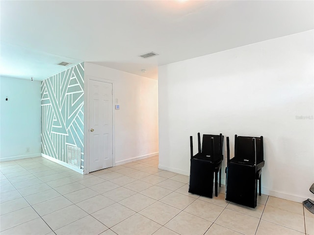 empty room with light tile patterned floors