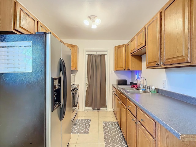 kitchen featuring light tile patterned flooring, sink, range, and stainless steel fridge with ice dispenser