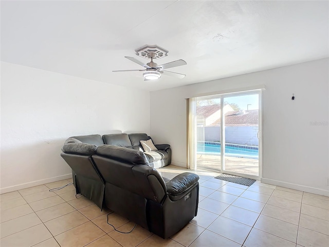 tiled living room with ceiling fan