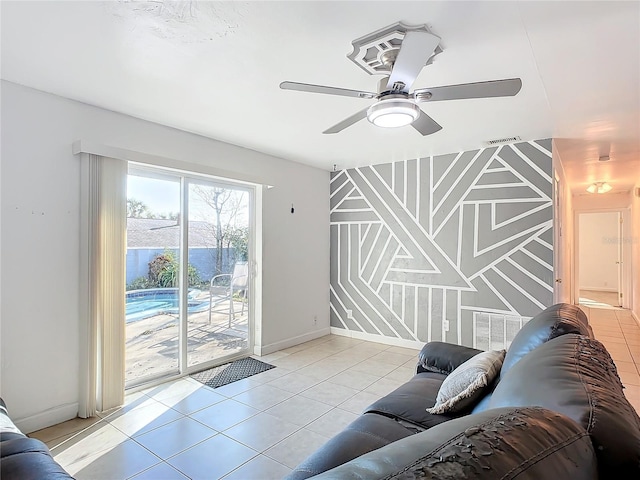 tiled living room featuring ceiling fan