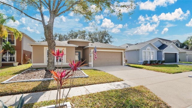 single story home with a garage and a front yard