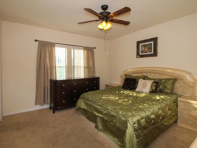 carpeted bedroom featuring baseboards