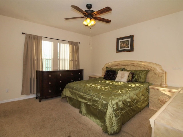 bedroom featuring ceiling fan and carpet flooring