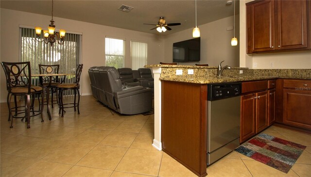 kitchen featuring light tile patterned floors, visible vents, open floor plan, dark stone counters, and dishwasher