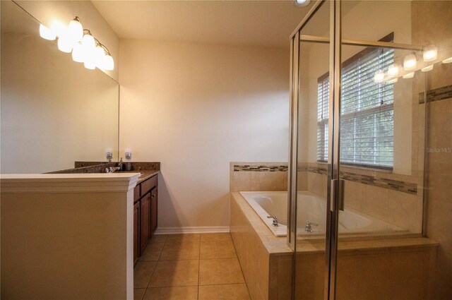 bathroom featuring vanity, baseboards, a bath, tile patterned floors, and an enclosed shower