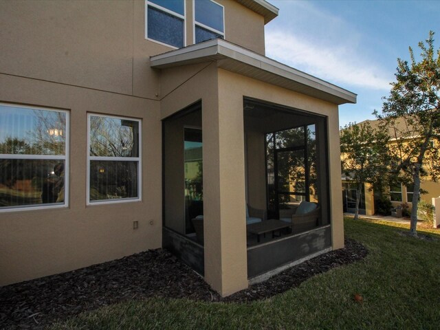 exterior space featuring a sunroom