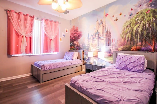 bedroom featuring hardwood / wood-style flooring and ceiling fan