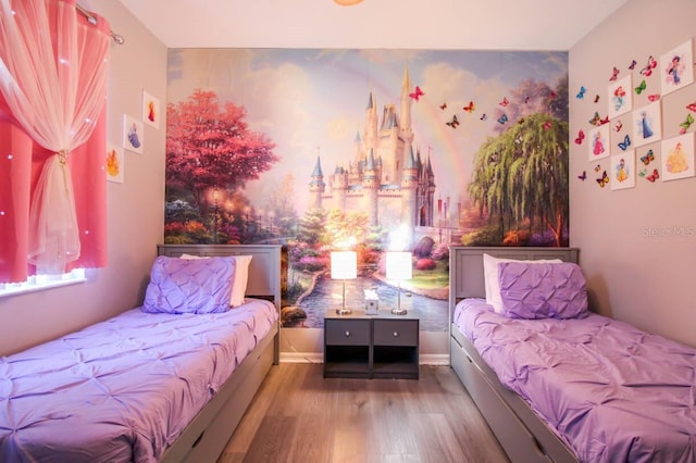 bedroom with wood-type flooring