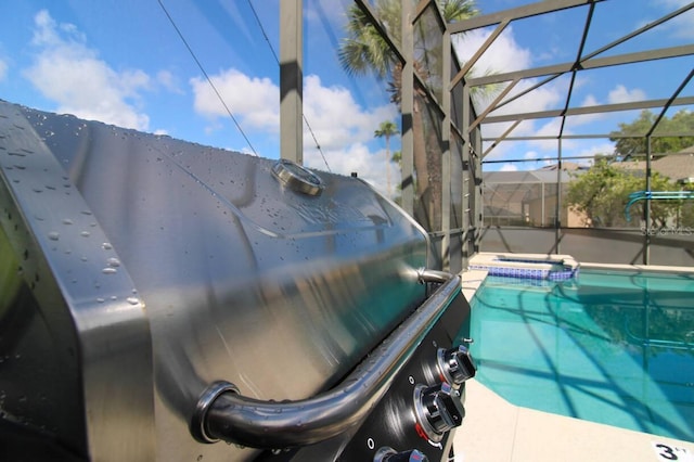 view of pool featuring glass enclosure