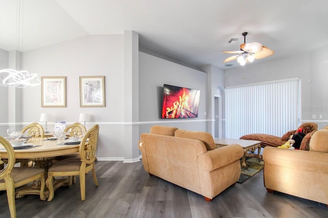 living room with lofted ceiling, dark hardwood / wood-style floors, and ceiling fan