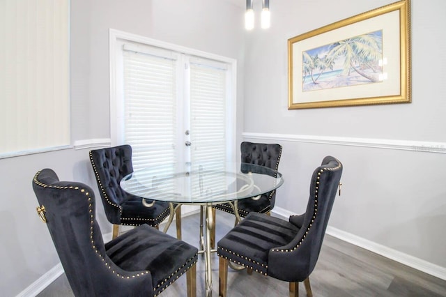 dining area featuring dark hardwood / wood-style floors