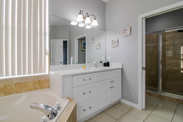 bathroom featuring shower with separate bathtub, tile patterned floors, and vanity