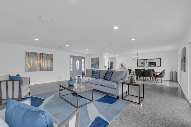 living room with an inviting chandelier