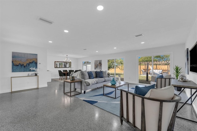 living room with a notable chandelier