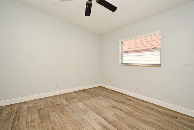 spare room featuring hardwood / wood-style flooring and ceiling fan