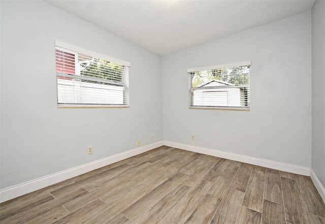 unfurnished room with light hardwood / wood-style floors