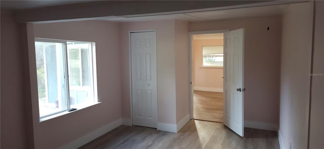 unfurnished bedroom with light hardwood / wood-style floors