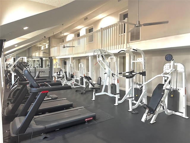 workout area featuring high vaulted ceiling