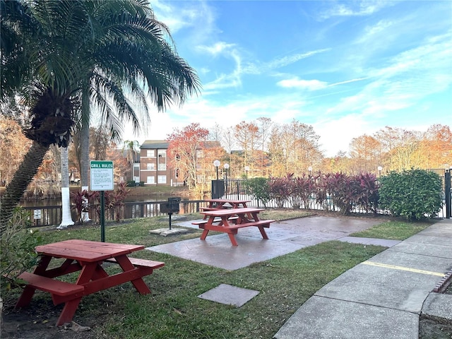 view of community featuring a yard and a patio area