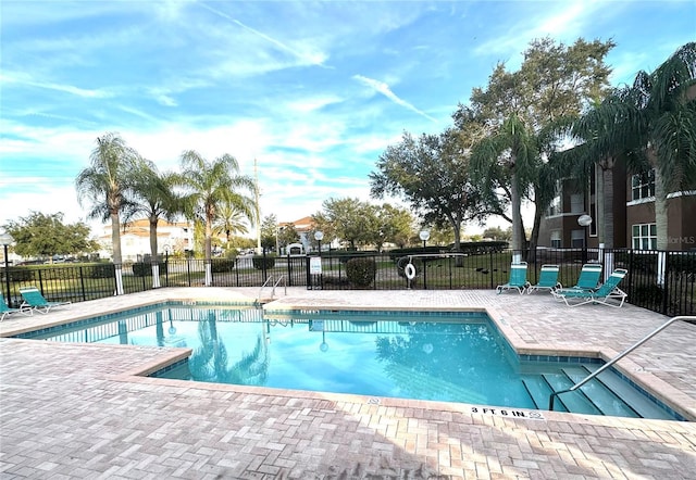 view of swimming pool with a patio area