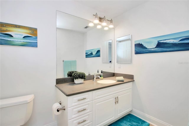 bathroom with vanity and toilet