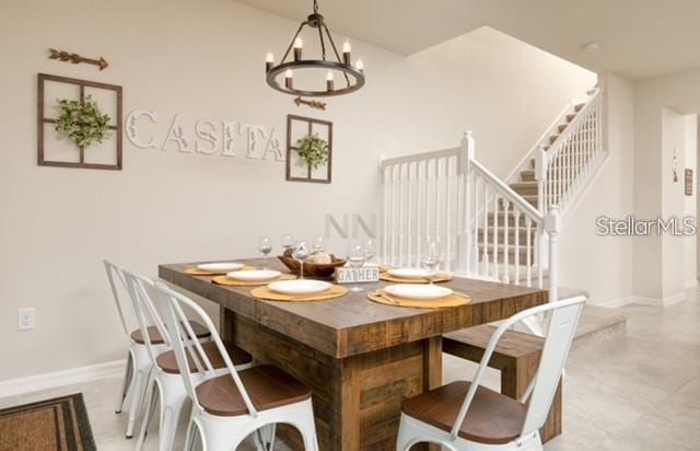 dining area featuring a notable chandelier