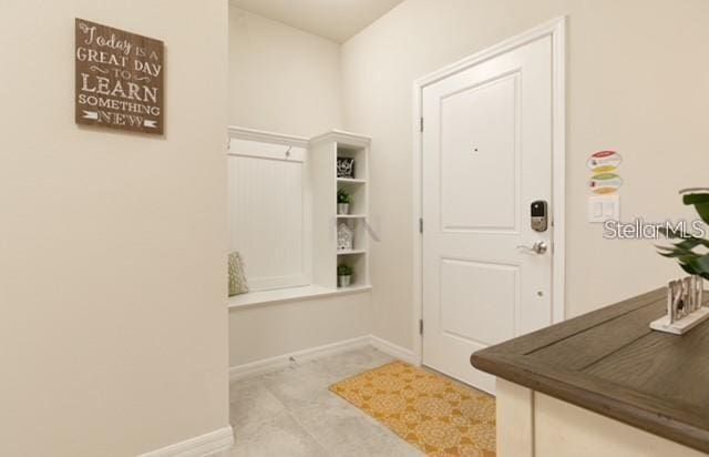 entryway featuring light tile patterned flooring