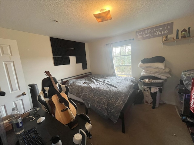 bedroom with carpet floors and a textured ceiling