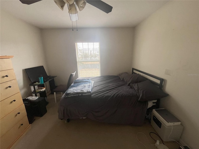 bedroom with ceiling fan and light colored carpet