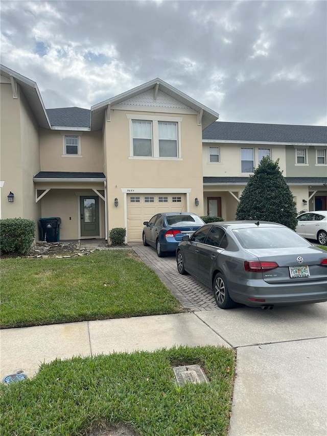 view of front facade with a garage and a front yard