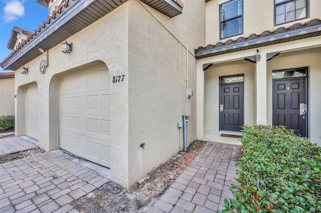 property entrance featuring a garage