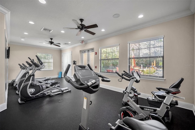 workout area featuring ornamental molding