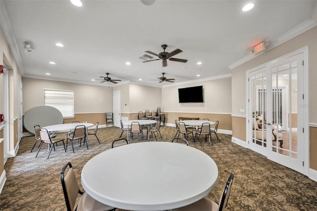 dining space with ornamental molding, dark carpet, and french doors