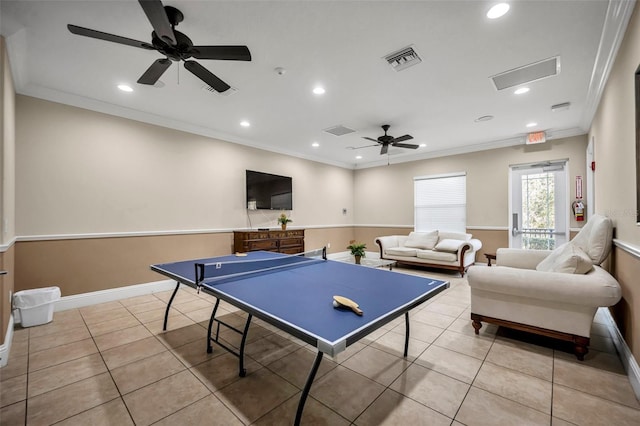 game room featuring crown molding, light tile patterned floors, and ceiling fan