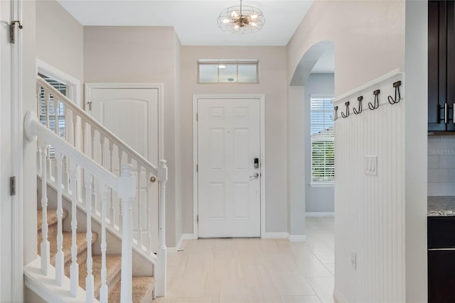 foyer with a notable chandelier