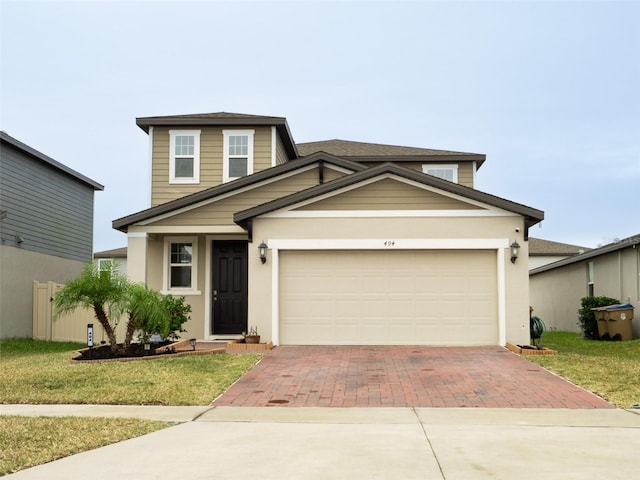 view of front facade featuring a garage and a front yard