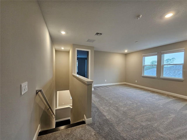 empty room with a water view and carpet