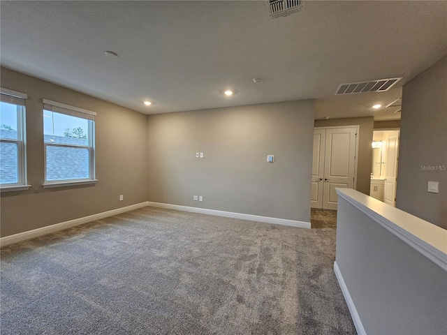 empty room with carpet flooring