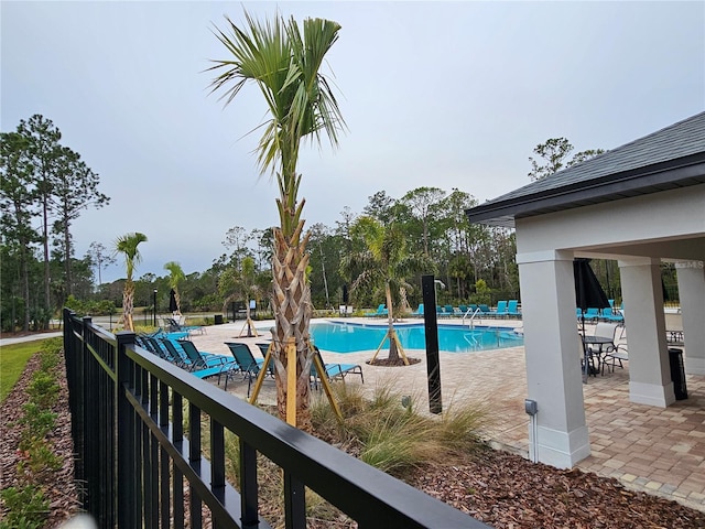 view of pool featuring a patio