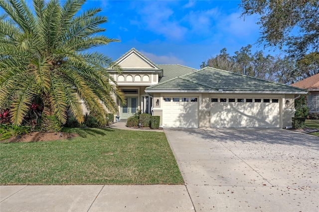 view of front of house featuring a garage and a front yard