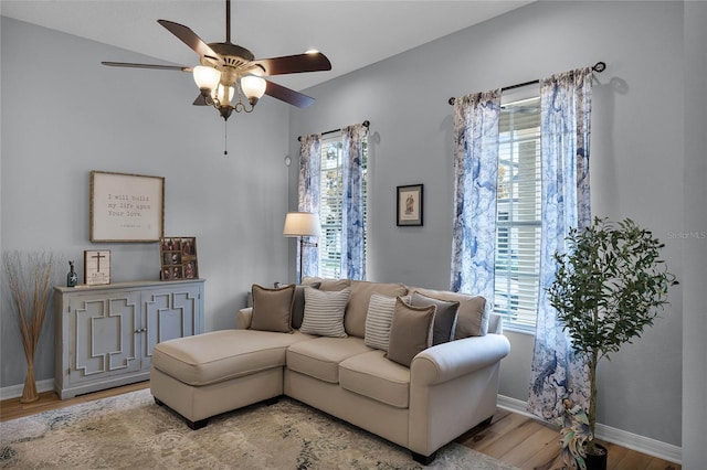 living room featuring hardwood / wood-style floors and ceiling fan