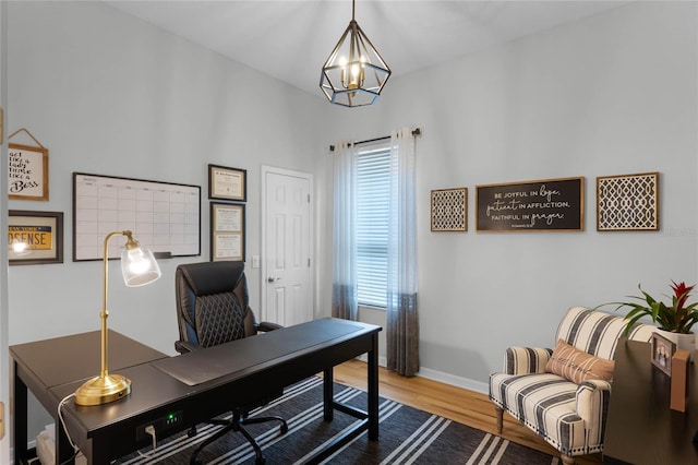 office area with a notable chandelier and wood-type flooring