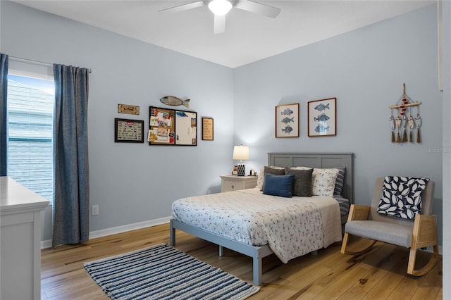 bedroom with ceiling fan and light wood-type flooring