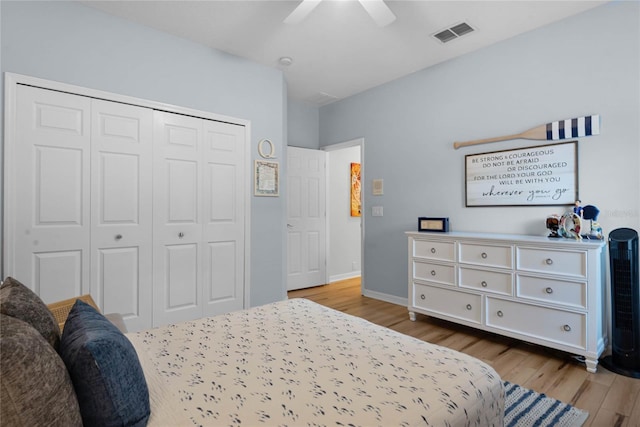 bedroom with a closet, ceiling fan, and light wood-type flooring