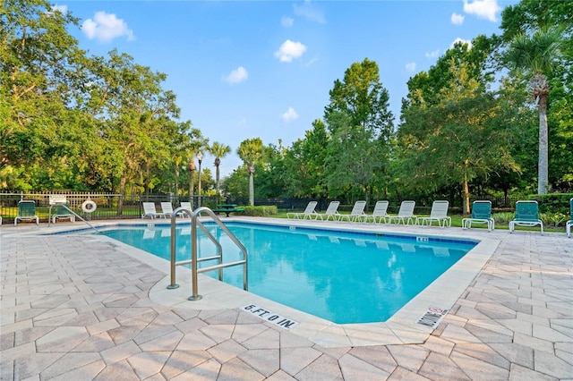 view of swimming pool featuring a patio area