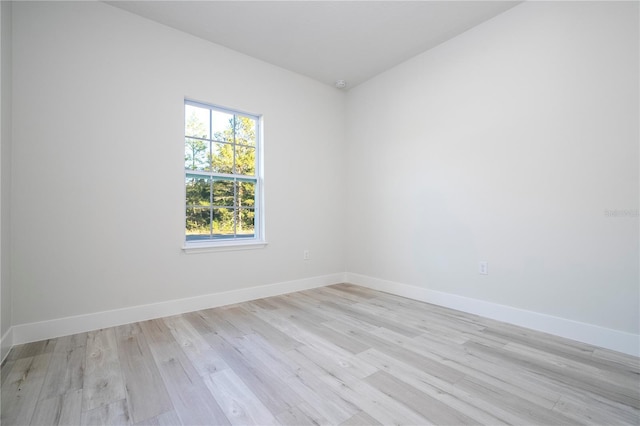 spare room with light hardwood / wood-style floors