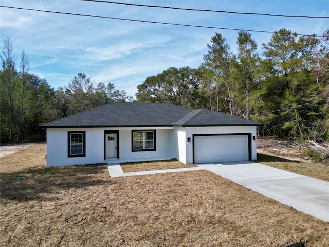 ranch-style home featuring a garage and a front yard