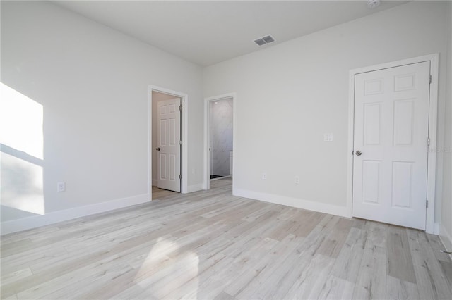 unfurnished room featuring light wood-type flooring