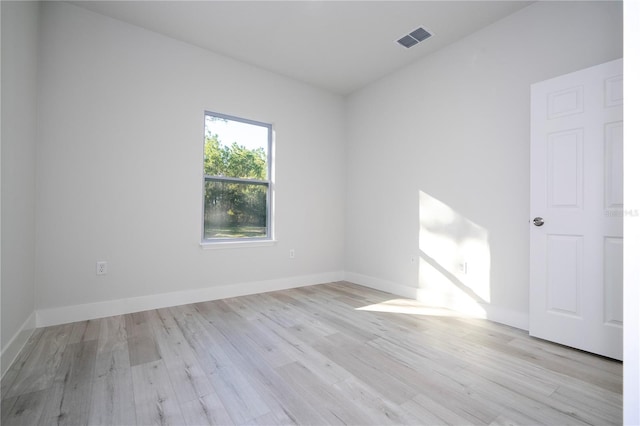 spare room with light hardwood / wood-style flooring